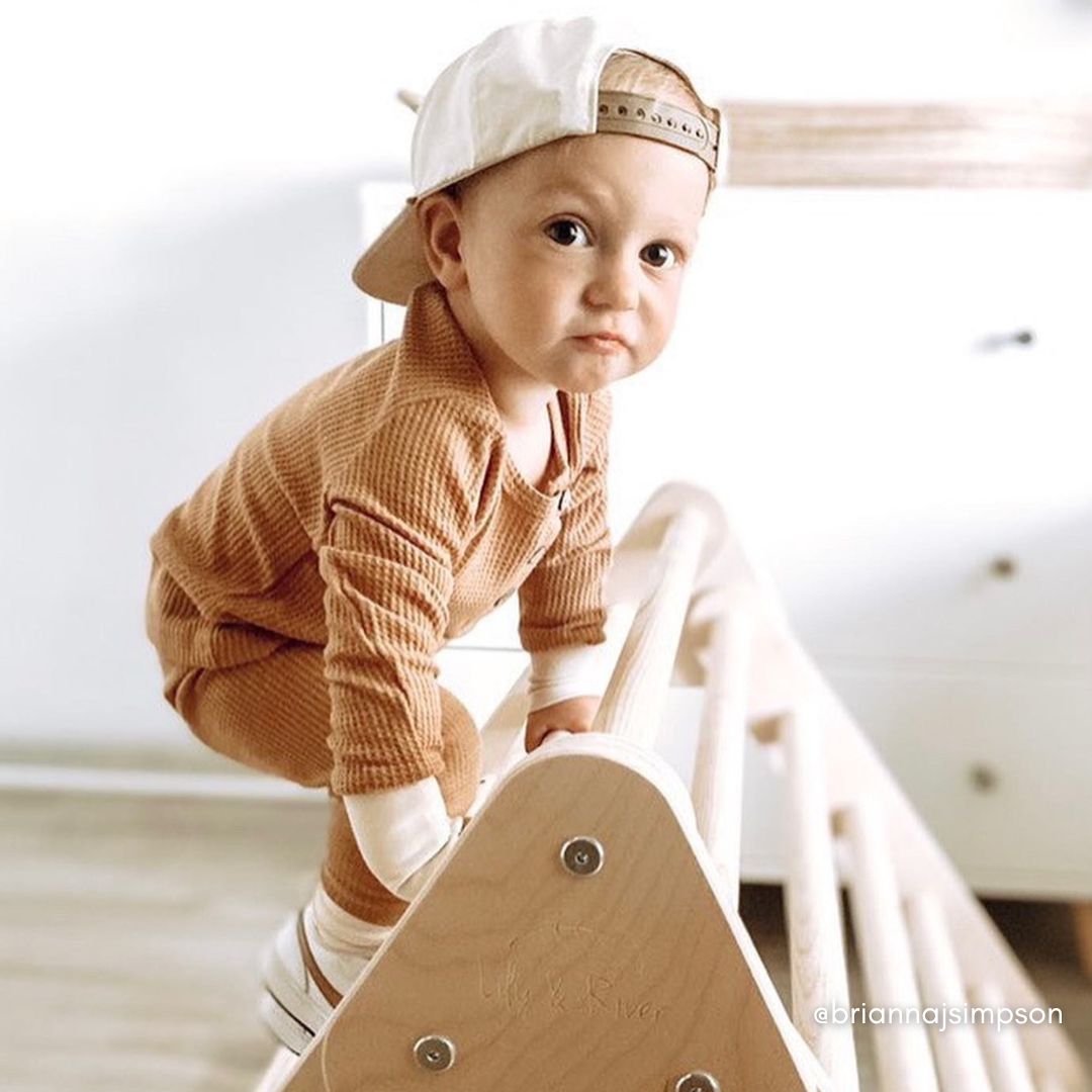 baby boy in a surf/skate inspired fit with the waffle set in caramel and matching cream and caramel hat and shoes.