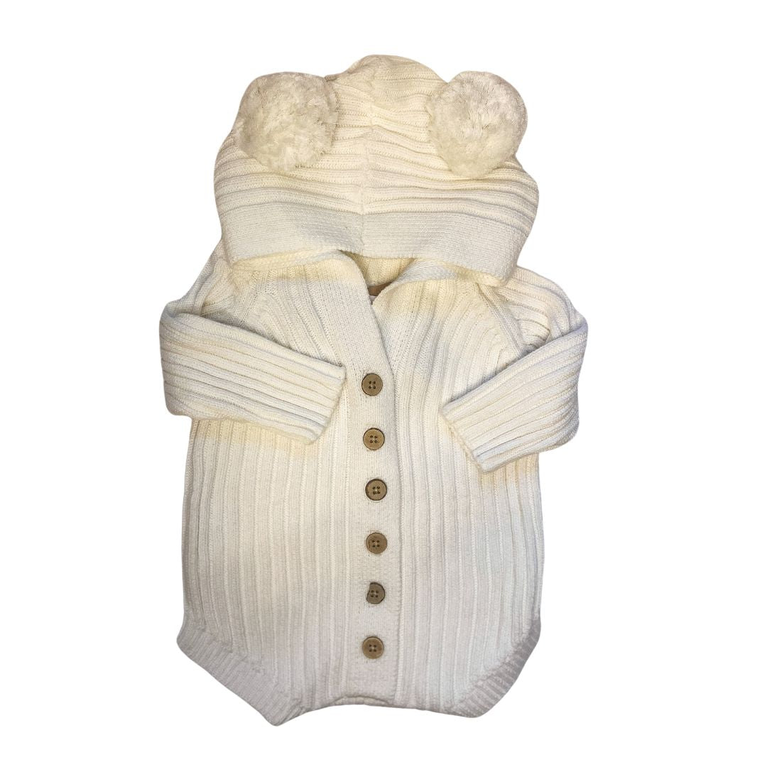Authentic Little B's Nursery hooded knit romper in milk with wood like buttons and pom poms for teddy bear ears on the hood.
