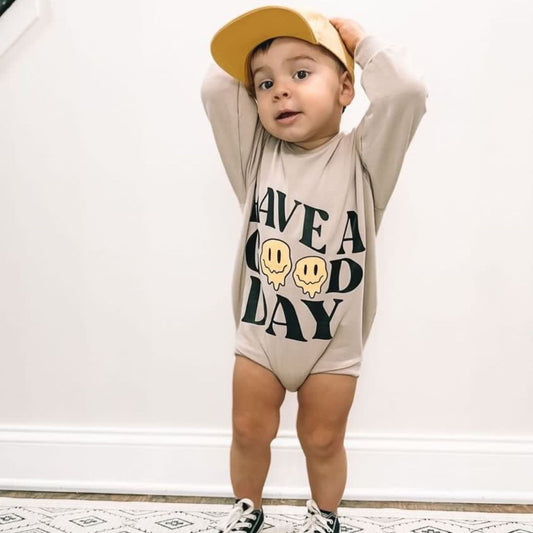 Britneylaurenamarin in the Good Day Romper, yellow hat, and black converse.