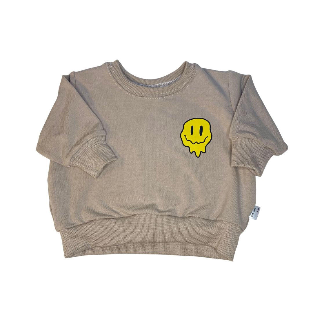Front of the "have a good day"sweatshirt in fawn with a single drippy smiley face