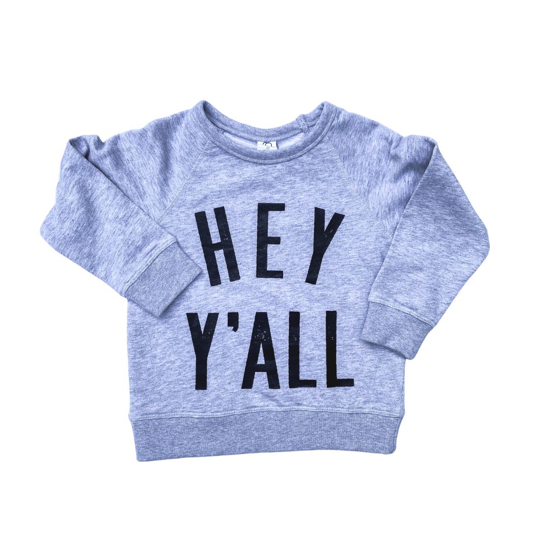 Flat lay on a white background of Hey Y'all pullover sweatshirt in heather grey by Gladfolk