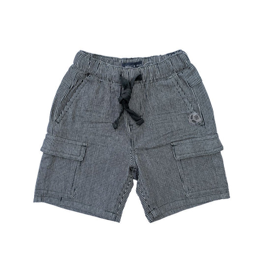 Flat lay of the railroad denim shorts in Forest