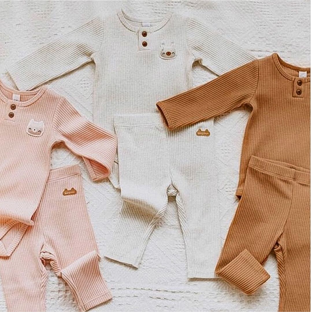 Ribbed Leggings in Blush, Caramel, and Snow with their matching rompers.