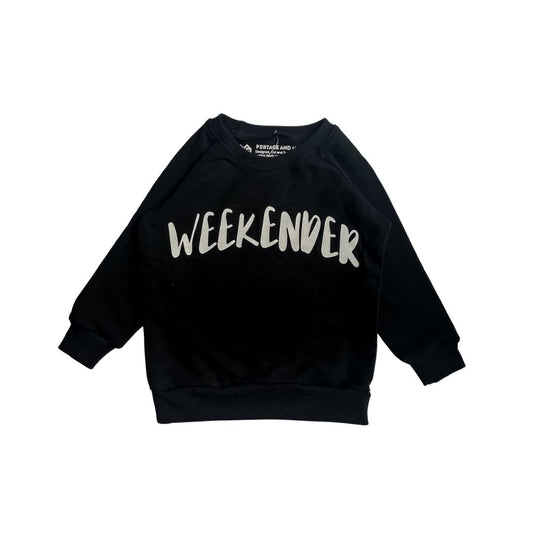 Flat lay of the weekender pullover in black
